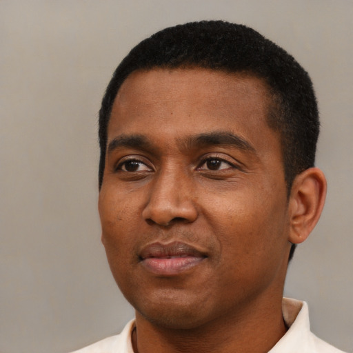 Neutral black young-adult male with short  black hair and brown eyes