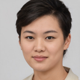 Joyful asian young-adult female with short  brown hair and brown eyes