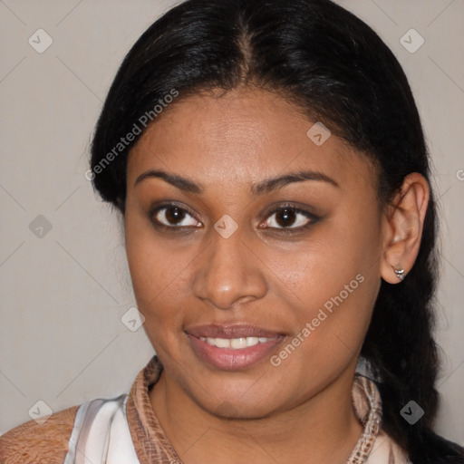 Joyful latino young-adult female with medium  brown hair and brown eyes