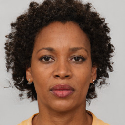 Neutral black adult female with short  brown hair and brown eyes