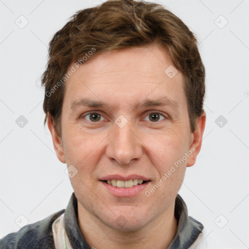 Joyful white adult male with short  brown hair and grey eyes