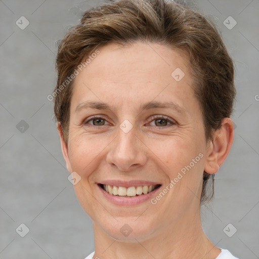 Joyful white adult female with short  brown hair and brown eyes