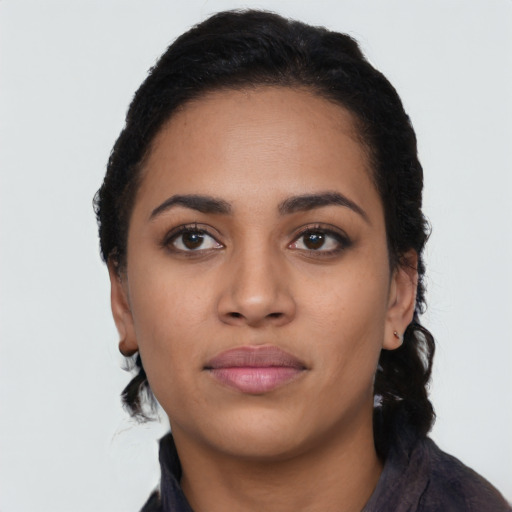Neutral latino young-adult female with long  black hair and brown eyes