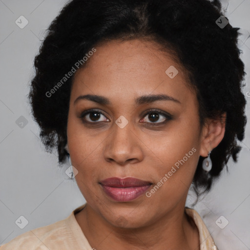 Joyful black adult female with short  brown hair and brown eyes