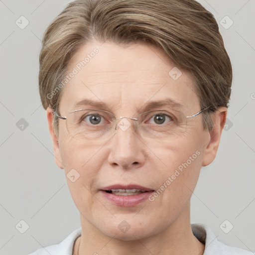 Joyful white adult female with short  brown hair and grey eyes