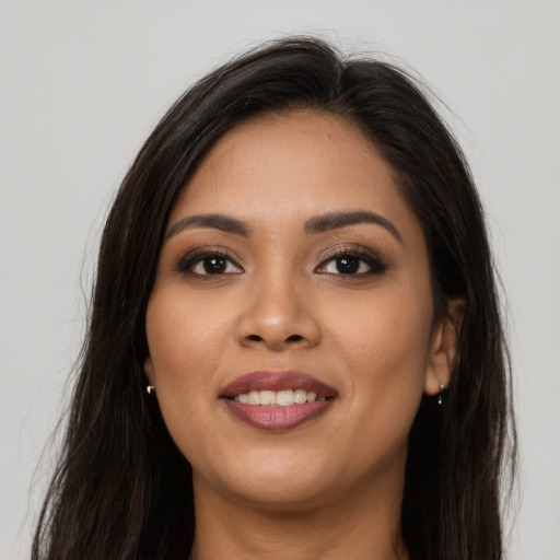 Joyful asian young-adult female with long  brown hair and brown eyes