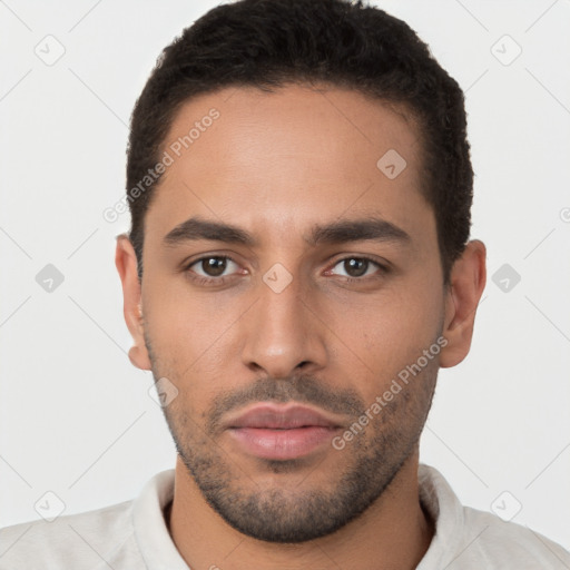 Neutral latino young-adult male with short  brown hair and brown eyes