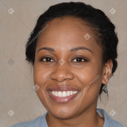 Joyful black adult female with short  brown hair and brown eyes