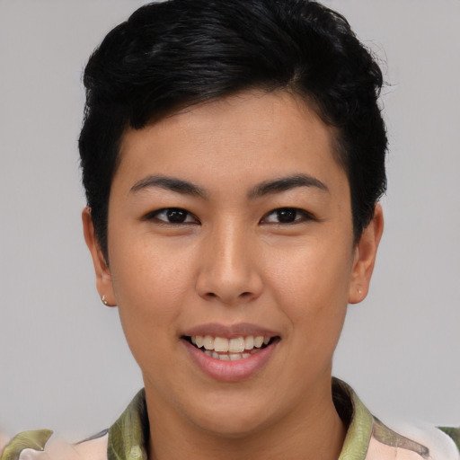 Joyful asian young-adult female with short  brown hair and brown eyes