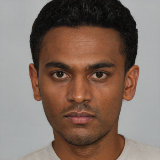 Neutral black young-adult male with short  black hair and brown eyes