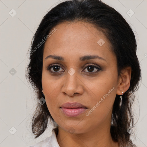 Joyful latino young-adult female with medium  brown hair and brown eyes