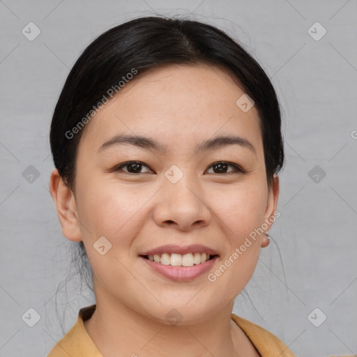 Joyful asian young-adult female with medium  brown hair and brown eyes