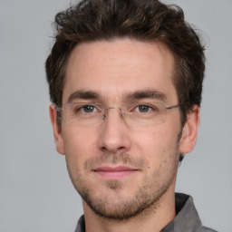Neutral white adult male with short  brown hair and grey eyes