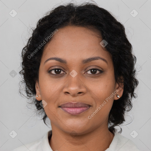 Joyful black young-adult female with medium  brown hair and brown eyes