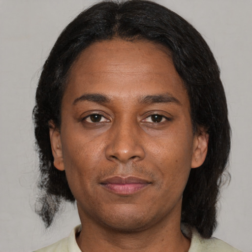 Neutral latino adult female with medium  black hair and brown eyes