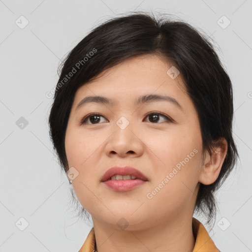 Joyful asian young-adult female with medium  brown hair and brown eyes