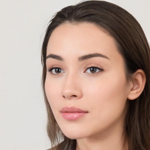 Neutral white young-adult female with long  brown hair and brown eyes