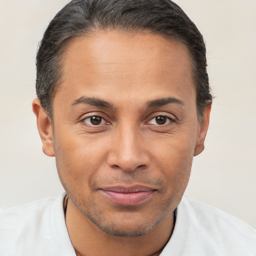 Joyful white adult male with short  brown hair and brown eyes