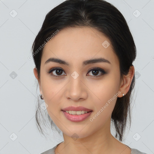 Joyful asian young-adult female with medium  black hair and brown eyes