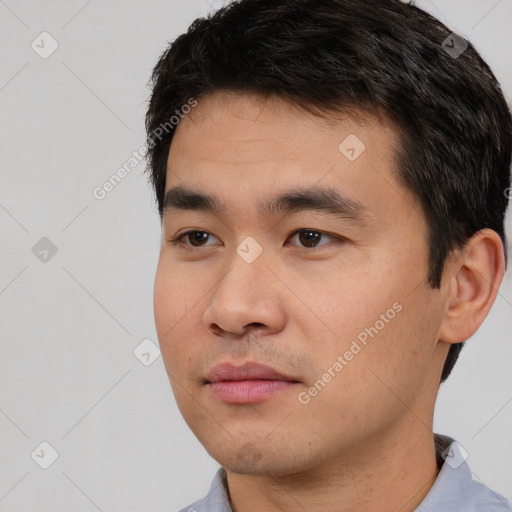 Neutral white young-adult male with short  black hair and brown eyes