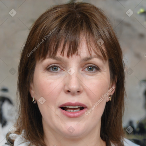 Joyful white adult female with medium  brown hair and grey eyes