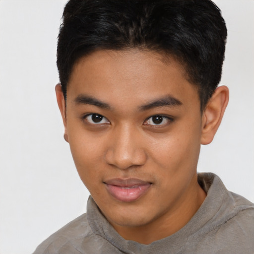 Neutral latino young-adult male with short  brown hair and brown eyes