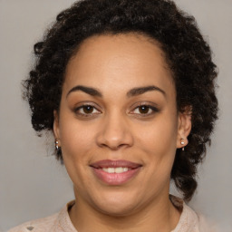 Joyful latino young-adult female with medium  brown hair and brown eyes