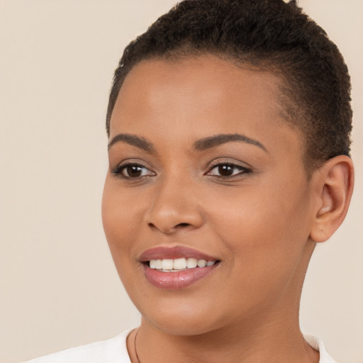 Joyful white young-adult female with short  brown hair and brown eyes