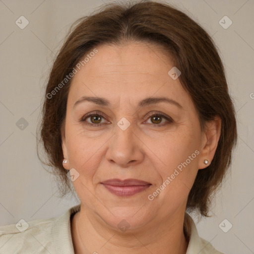 Joyful white adult female with medium  brown hair and brown eyes