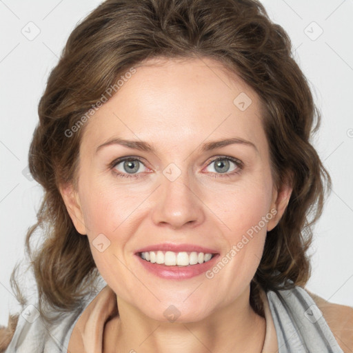 Joyful white young-adult female with medium  brown hair and blue eyes