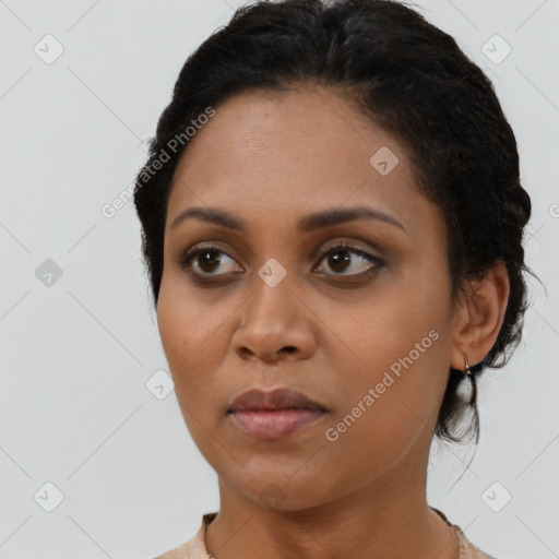 Neutral black young-adult female with short  brown hair and brown eyes