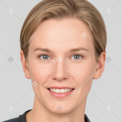 Joyful white young-adult female with short  brown hair and grey eyes