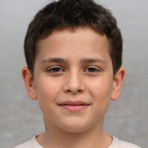 Joyful white child male with short  brown hair and brown eyes