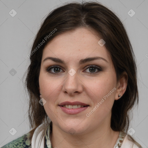 Joyful white young-adult female with medium  brown hair and brown eyes