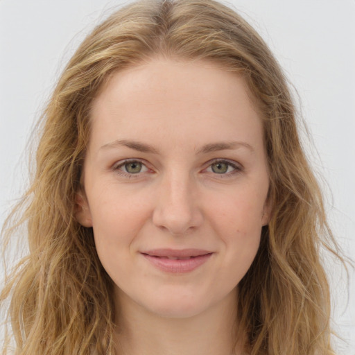 Joyful white young-adult female with long  brown hair and green eyes