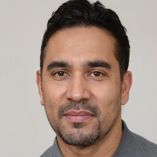 Neutral white adult male with short  black hair and brown eyes