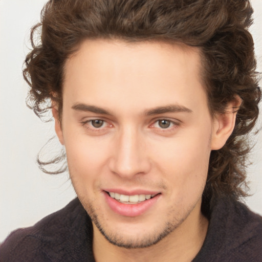 Joyful white young-adult male with medium  brown hair and brown eyes