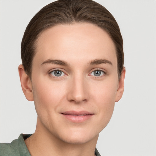 Joyful white young-adult female with short  brown hair and grey eyes