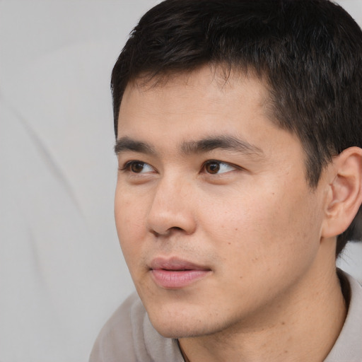 Neutral white young-adult male with short  black hair and brown eyes
