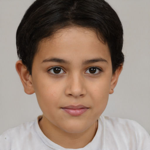 Joyful latino child female with short  brown hair and brown eyes