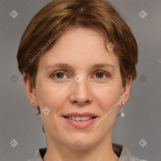 Joyful white adult female with short  brown hair and grey eyes