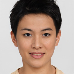 Joyful asian young-adult female with short  brown hair and brown eyes