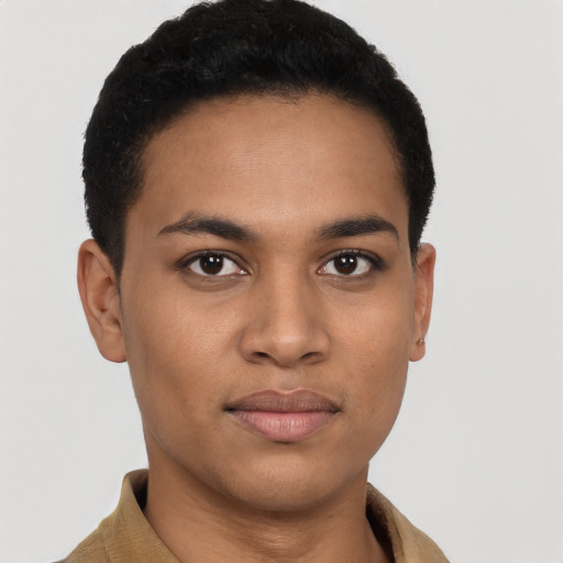 Joyful latino young-adult male with short  brown hair and brown eyes