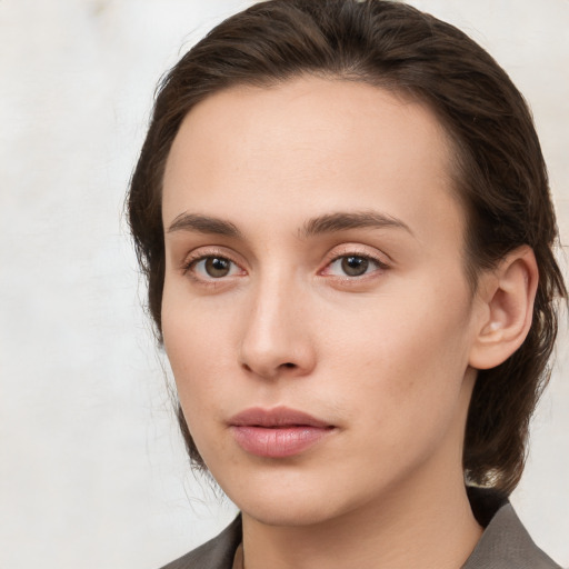 Neutral white young-adult female with medium  brown hair and brown eyes