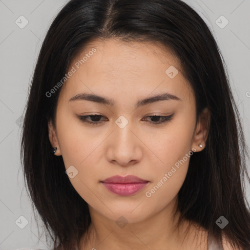 Joyful asian young-adult female with long  brown hair and brown eyes