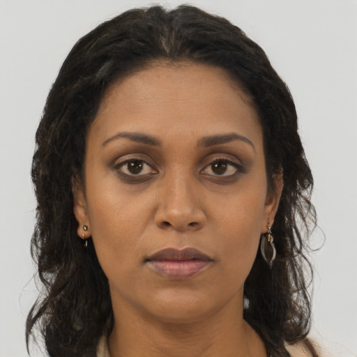 Neutral black adult female with long  brown hair and brown eyes