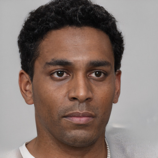 Neutral black young-adult male with short  black hair and brown eyes