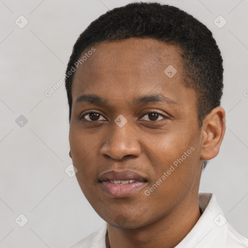 Joyful black young-adult male with short  black hair and brown eyes