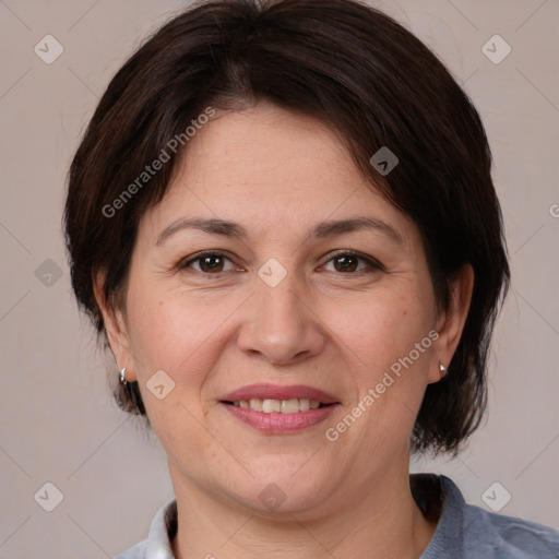 Joyful white adult female with medium  brown hair and brown eyes