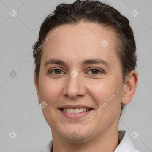 Joyful white adult female with short  brown hair and brown eyes